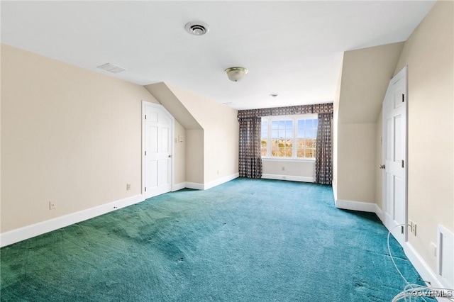 additional living space with lofted ceiling and carpet flooring