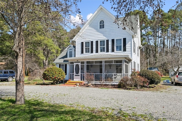 view of front of home with a sunroom