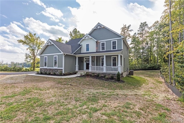 craftsman-style home with a porch and a front lawn