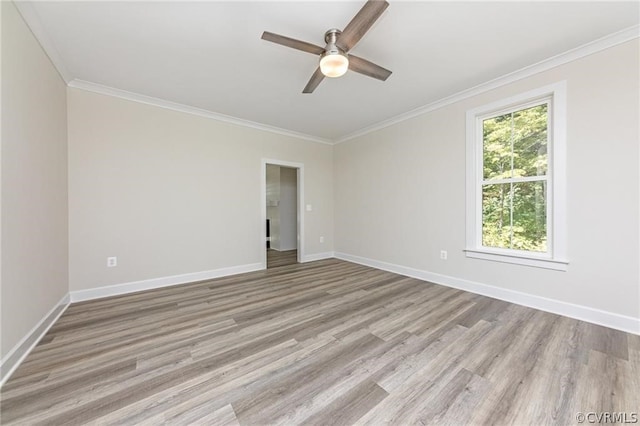 unfurnished room featuring hardwood / wood-style floors, ornamental molding, and ceiling fan