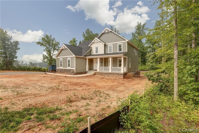 view of front of property featuring central AC and covered porch