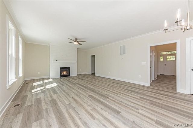 unfurnished living room with ceiling fan, light hardwood / wood-style flooring, a fireplace, and ornamental molding