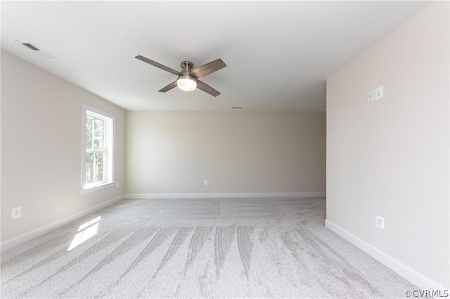 unfurnished room featuring carpet and ceiling fan