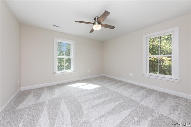 carpeted empty room with ceiling fan