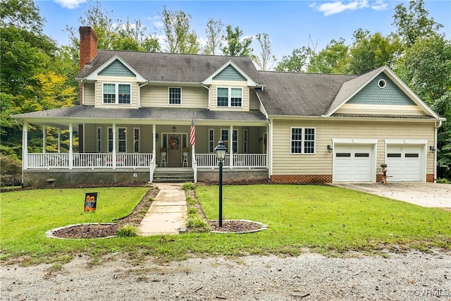 view of front of property with a porch, a garage, and a front yard