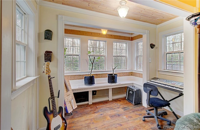 office space with wood-type flooring, wooden ceiling, and ornamental molding