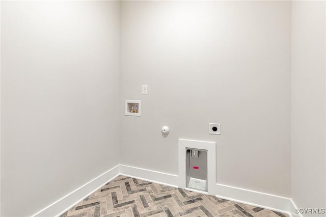 laundry room featuring hookup for a washing machine, hookup for an electric dryer, baseboards, and gas dryer hookup