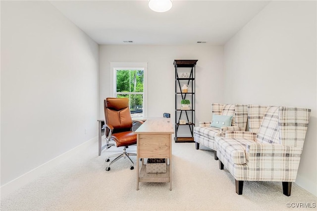 carpeted home office with baseboards