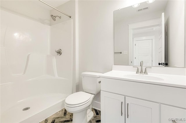 full bath featuring a shower, toilet, and vanity