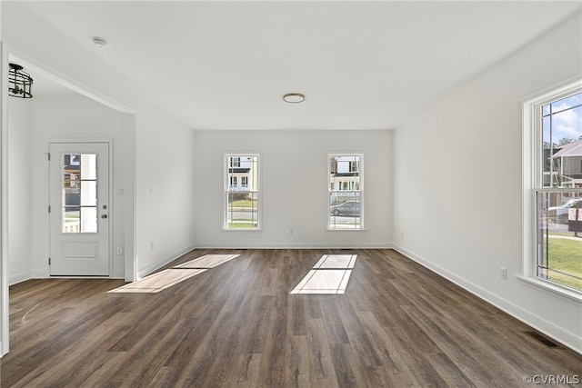 spare room featuring dark hardwood / wood-style flooring