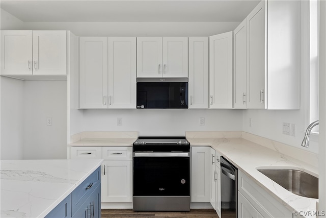 kitchen with sink, white cabinetry, dark hardwood / wood-style flooring, and stainless steel appliances