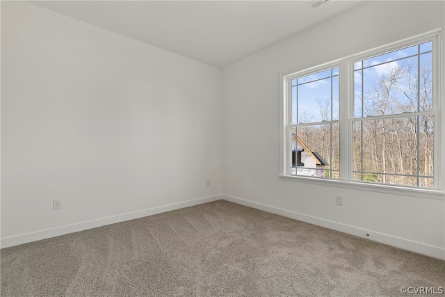 unfurnished room with light carpet