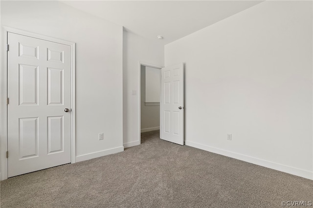 unfurnished bedroom featuring light colored carpet