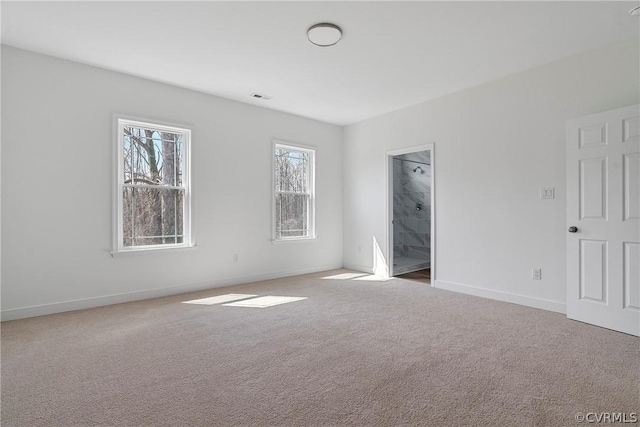 unfurnished bedroom with visible vents, baseboards, and carpet