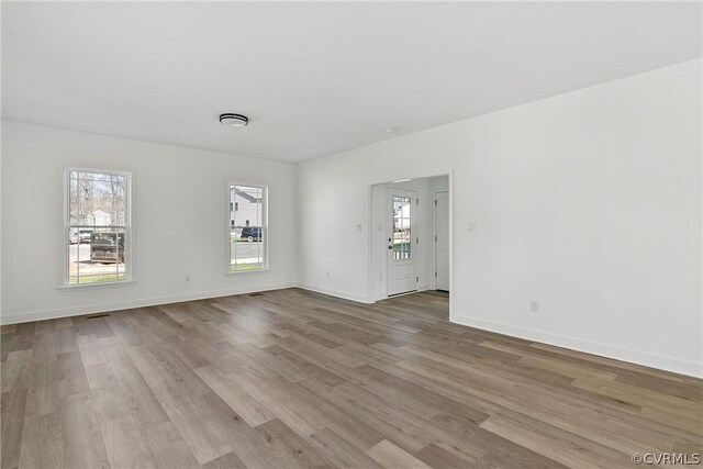 unfurnished room featuring wood-type flooring