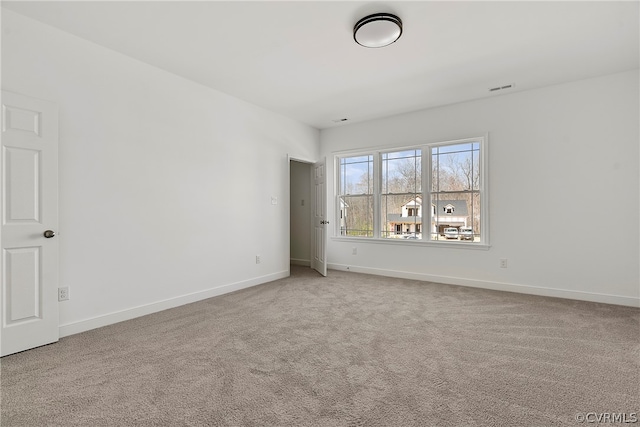 unfurnished room featuring carpet