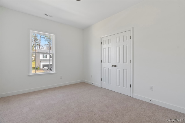 spare room with light carpet