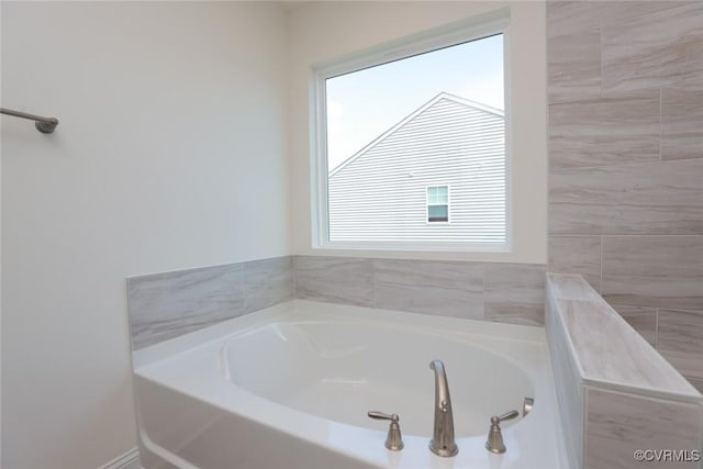 full bathroom featuring a bath