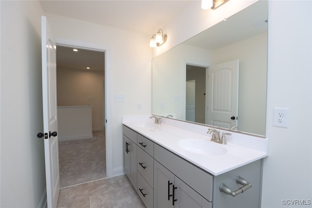 bathroom featuring tile patterned flooring and double sink vanity