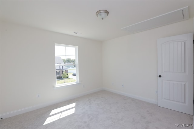 empty room featuring light colored carpet