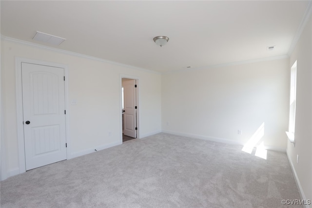 unfurnished room featuring carpet flooring and ornamental molding