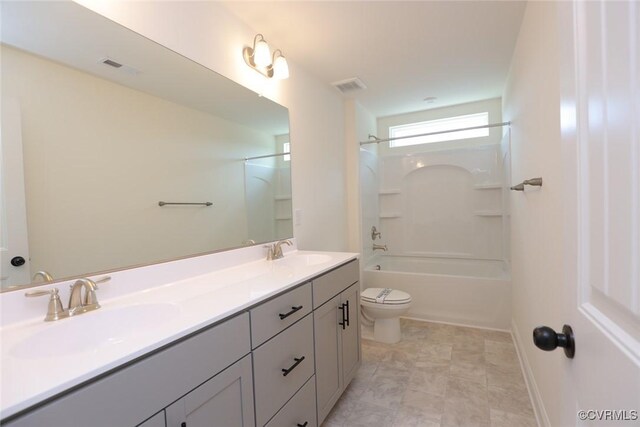 full bathroom featuring toilet, shower / bath combination, double sink vanity, and tile patterned floors