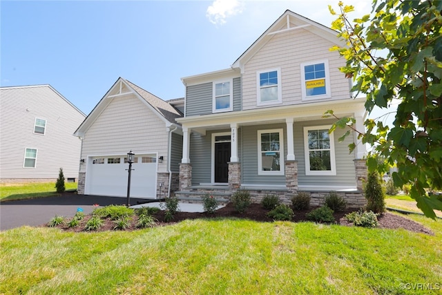 craftsman-style house with a garage and a front yard