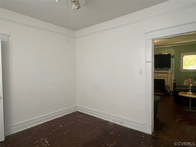 empty room with dark hardwood / wood-style floors