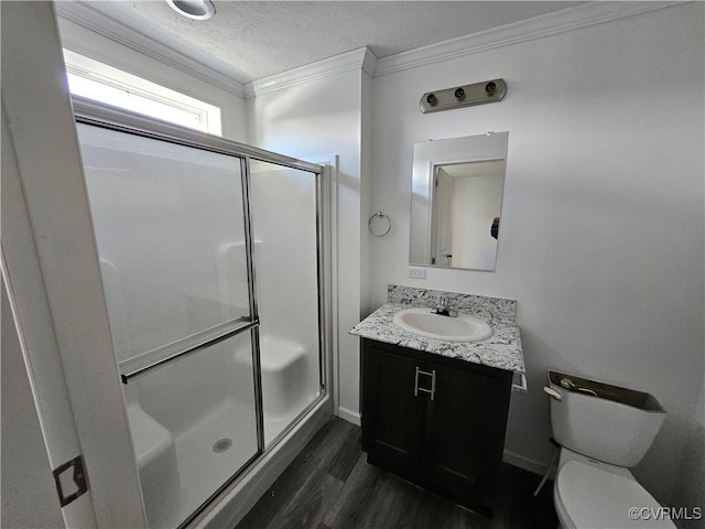 710 Wesley St, Petersburg, VA 23803 - full bathroom with crown molding, a stall shower, toilet, wood finished floors, and vanity