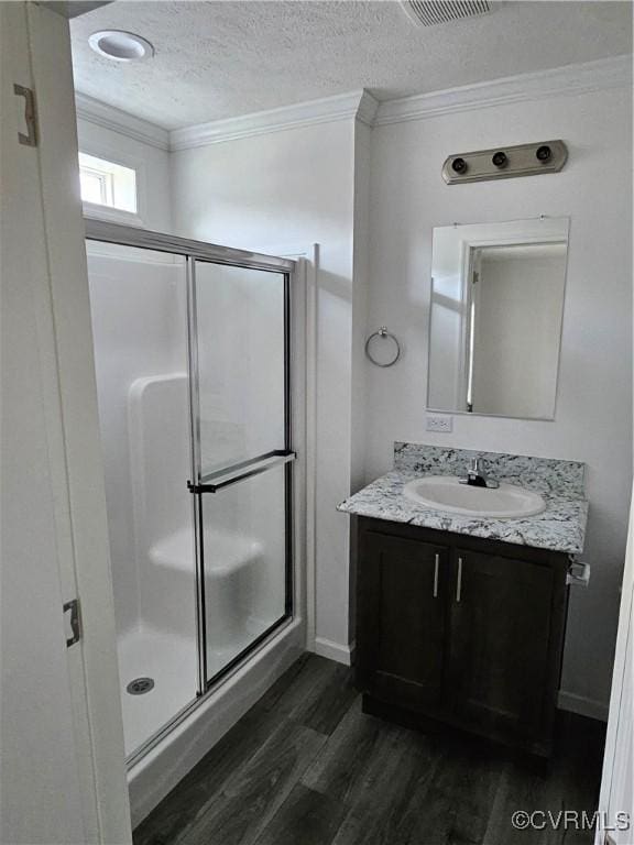 710 Wesley St, Petersburg, VA 23803 - full bath with wood finished floors, a stall shower, crown molding, and vanity