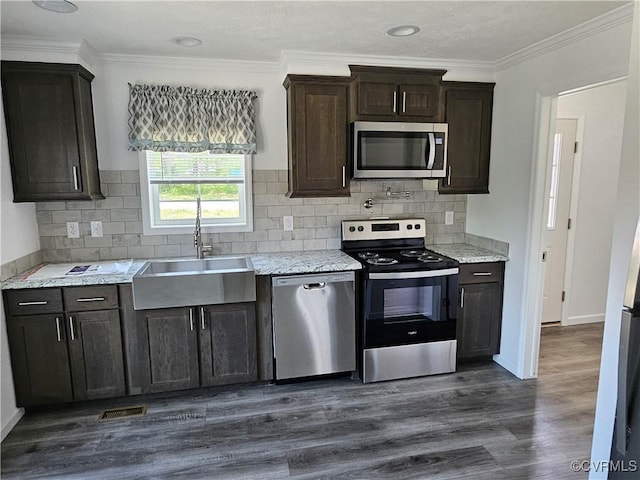 710 Wesley St, Petersburg, VA 23803 - kitchen with a sink, visible vents, ornamental molding, appliances with stainless steel finishes, and dark wood finished floors
