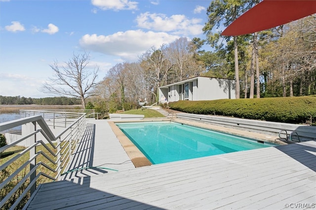 view of pool with a wooden deck