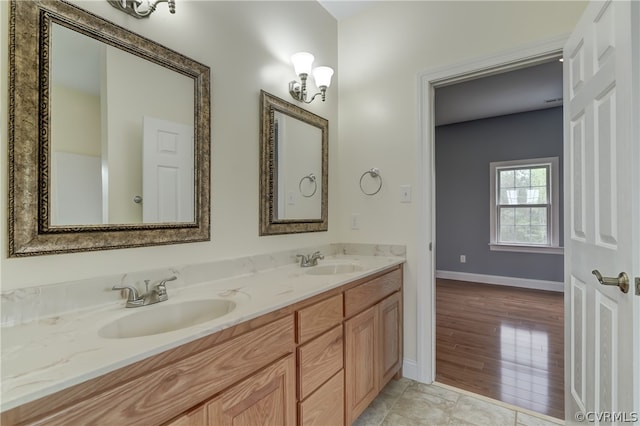 bathroom with vanity and wood-type flooring