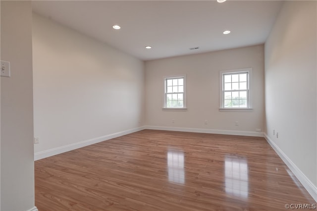 unfurnished room featuring light wood-type flooring