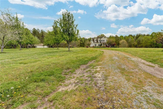 view of yard with a rural view