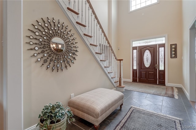 entryway with a towering ceiling