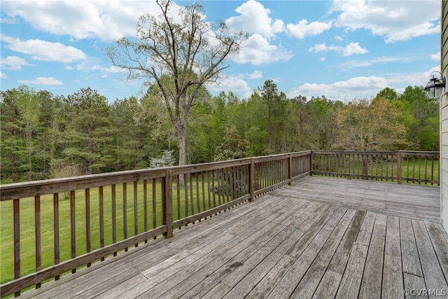 wooden terrace with a yard