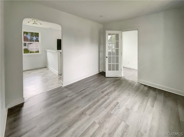 unfurnished room featuring wood-type flooring