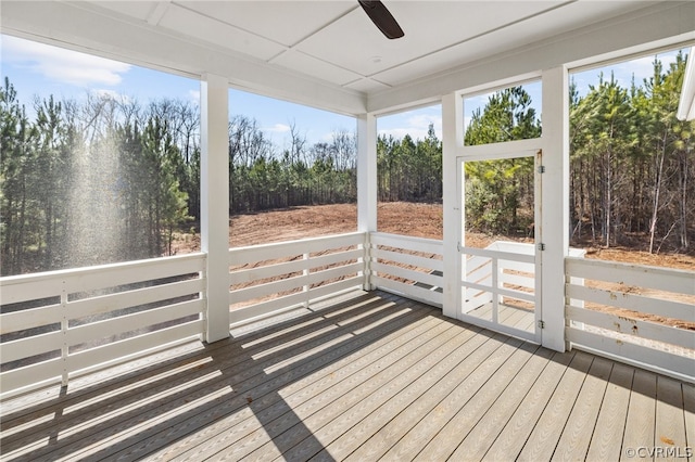 unfurnished sunroom with plenty of natural light and ceiling fan