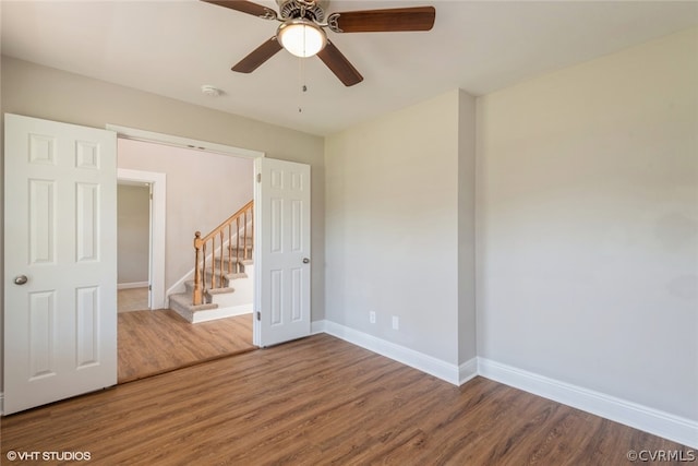 empty room featuring ceiling fan and hardwood / wood-style flooring