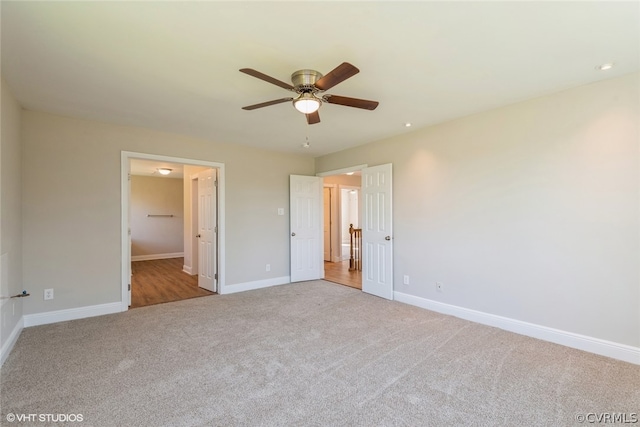 unfurnished bedroom featuring ceiling fan and carpet floors