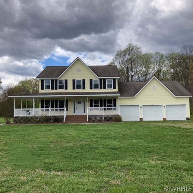 view of front facade featuring a garage, a porch, and a front yard