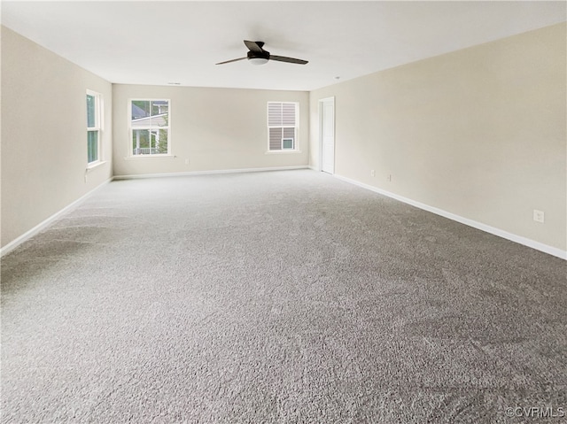 carpeted empty room with ceiling fan