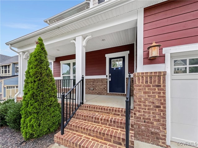 doorway to property with covered porch