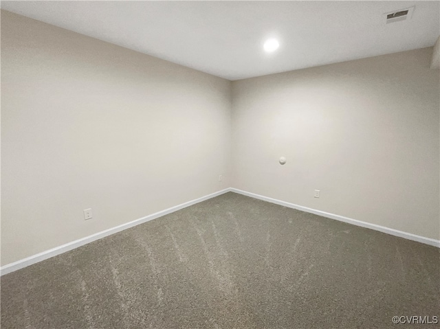 empty room with dark carpet