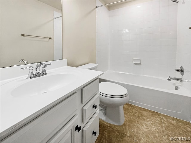 full bathroom with tile patterned flooring, tiled shower / bath combo, vanity, and toilet