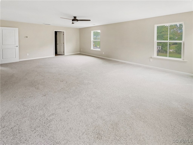 carpeted empty room featuring ceiling fan