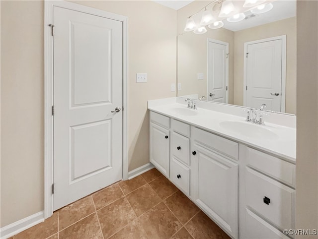 bathroom with vanity and tile patterned flooring