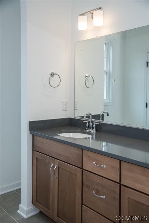 bathroom with vanity and tile patterned flooring