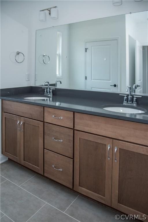 bathroom with vanity and tile patterned flooring